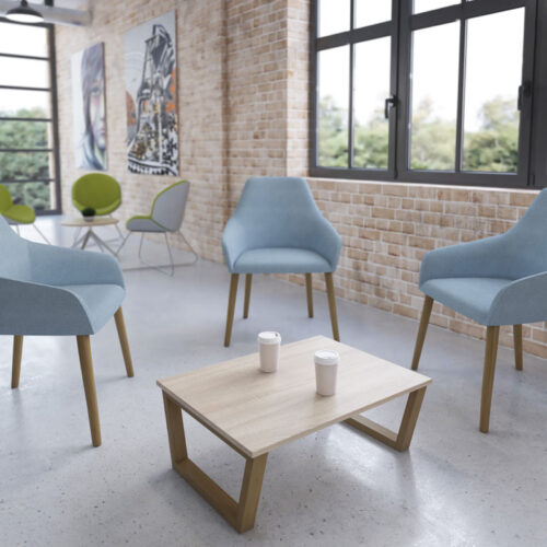 4-Legged reception chairs in pale blue fabric and wooden legs, around a rectangular coffee table