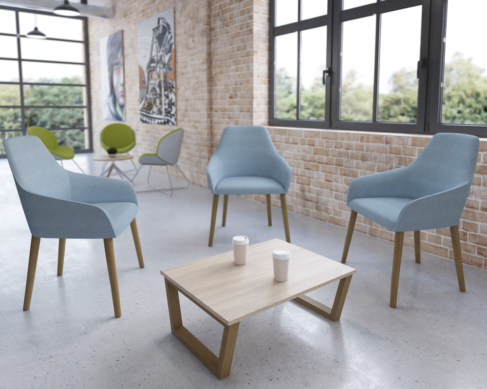 4-Legged reception chairs in pale blue fabric and wooden legs, around a rectangular coffee table