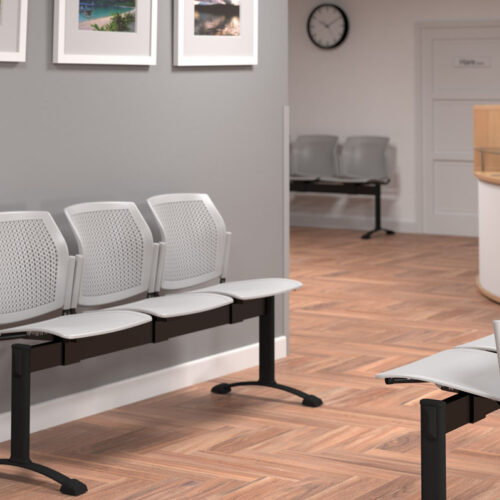 Waiting room benches in grey plastic and black frame, in a hospital waiting room