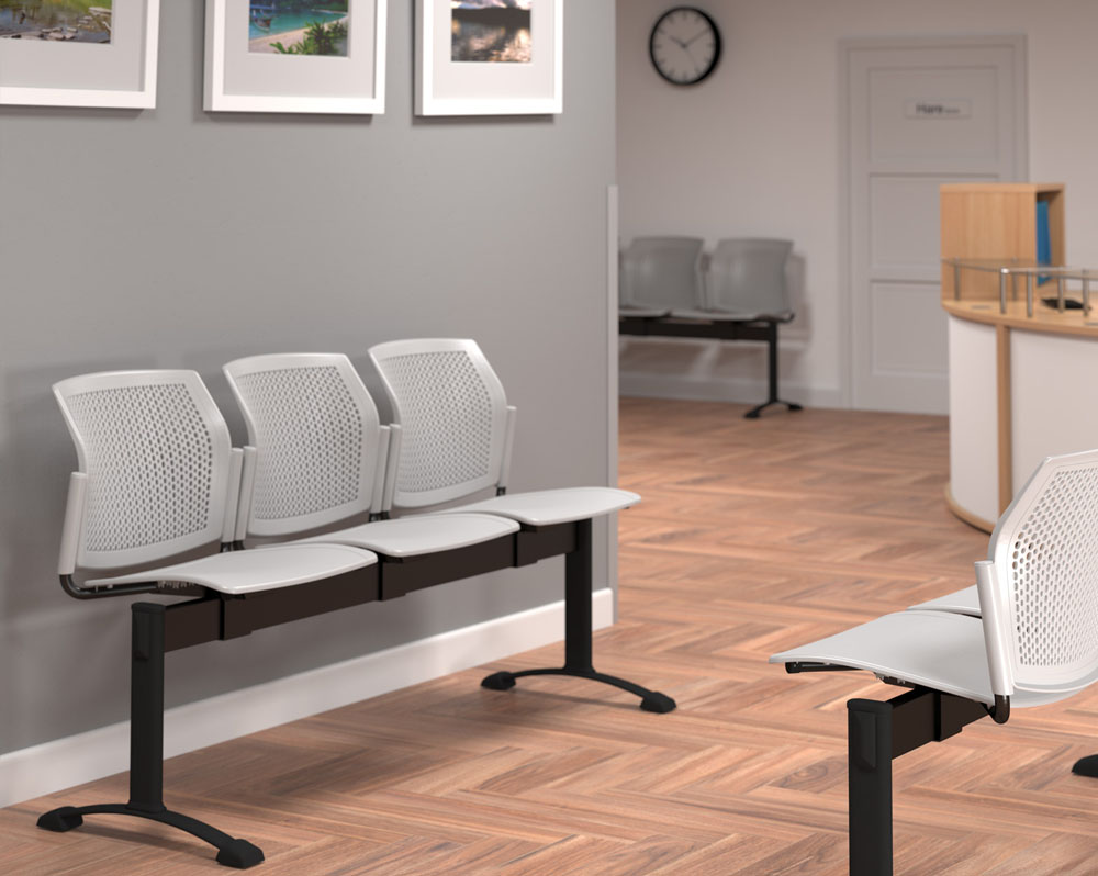 Waiting room benches in grey plastic and black frame, in a hospital waiting room