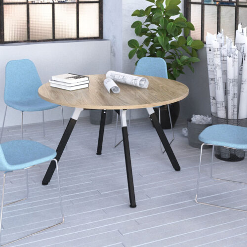 Breakout chairs with sled frame and a circular coffee table