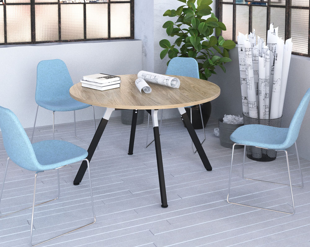 Breakout chairs with sled frame and a circular coffee table