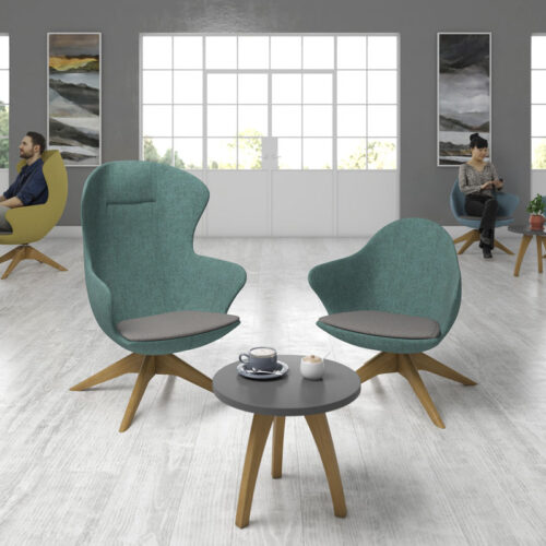 Two lounge chairs in green fabric and a small circular coffee table