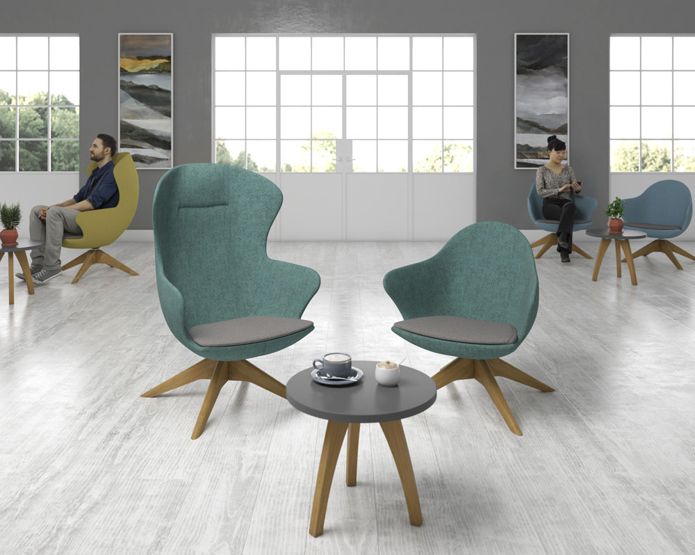 Two lounge chairs in green fabric and a small circular coffee table