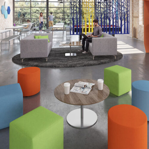 A range of upholstered stools around a small circular coffee table