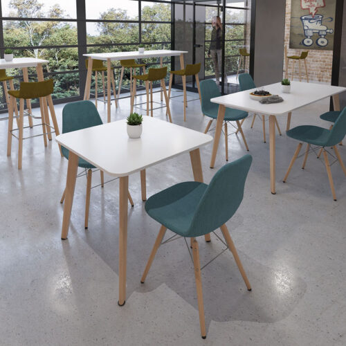 Café and bistro chairs with wooden legs and green fabric seat. Around a square dining table, with white top and wooden legs