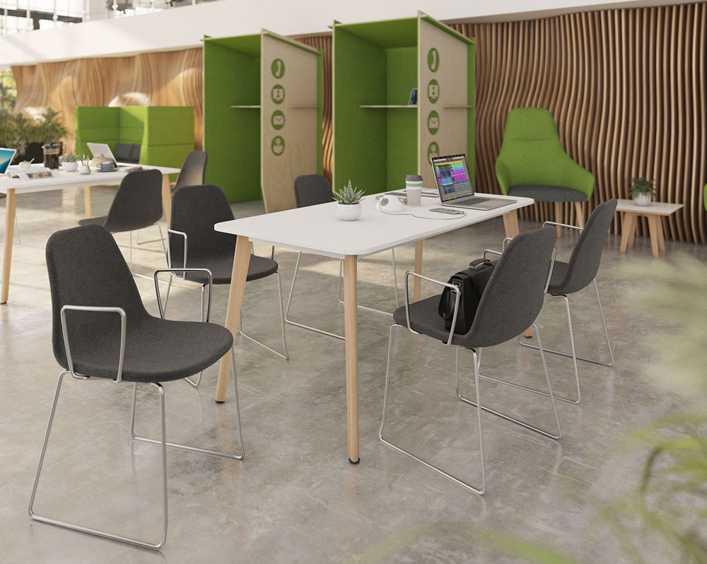 Café and bistro chairs with chrome sled frame and grey fabric seat. Around a rectangular dining table, with white top and wooden legs