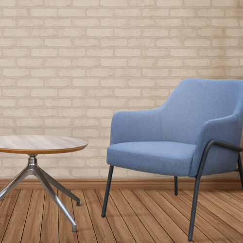 Fabric waiting room chair in blue and a small round coffee table
