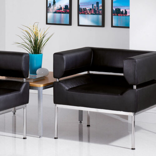 Commercial faux leather sofa and armchair in black and with silver metal feet
