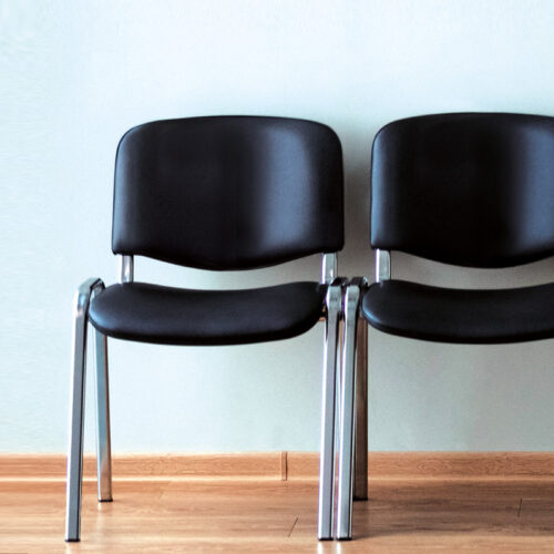 Faux leather waiting Room chairs in black and with a chrome frame