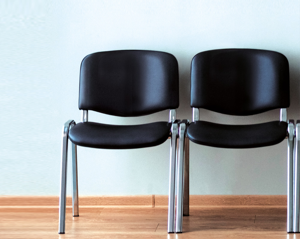 Faux leather waiting Room chairs in black and with a chrome frame
