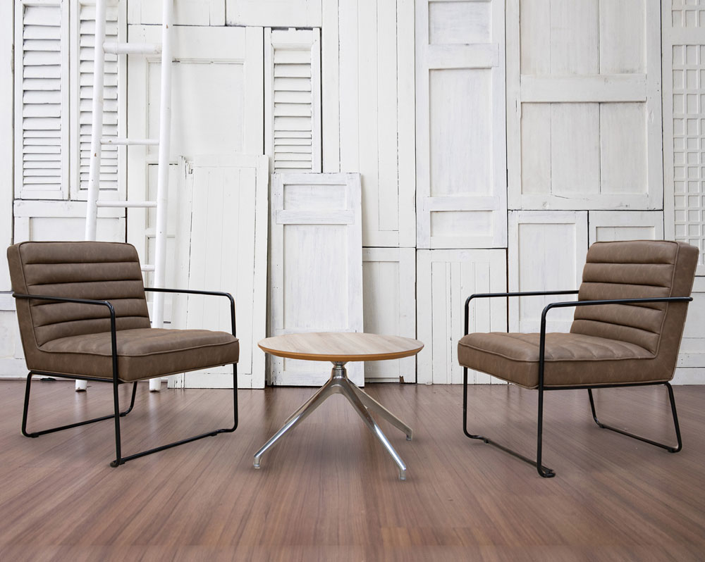 2 Industrial reception chairs in brown faux leather and a small round coffee table