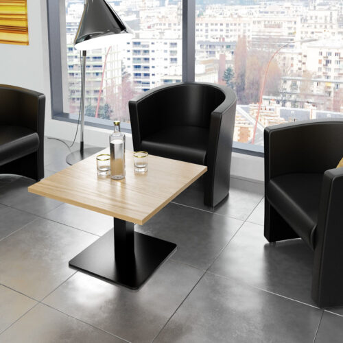 Three leather waiting room tub chairs in black and a small square coffee table
