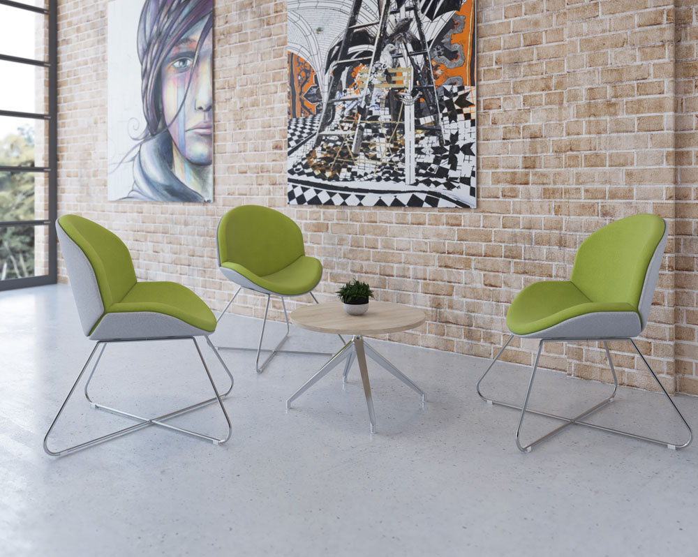 Three lounge chairs in green and grey fabric, and with a criss-cross chrome sled frame, around a small circular coffee table