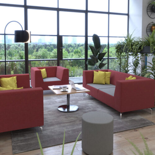 Low back sofa and breakout chairs in red and grey fabric around a square coffee table