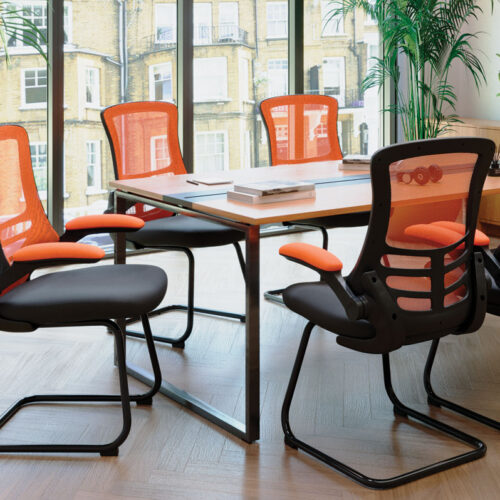 Meeting chairs with flip up arms around a meeting table