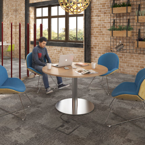 4 Multipurpose breakout chairs around a circular meeting table
