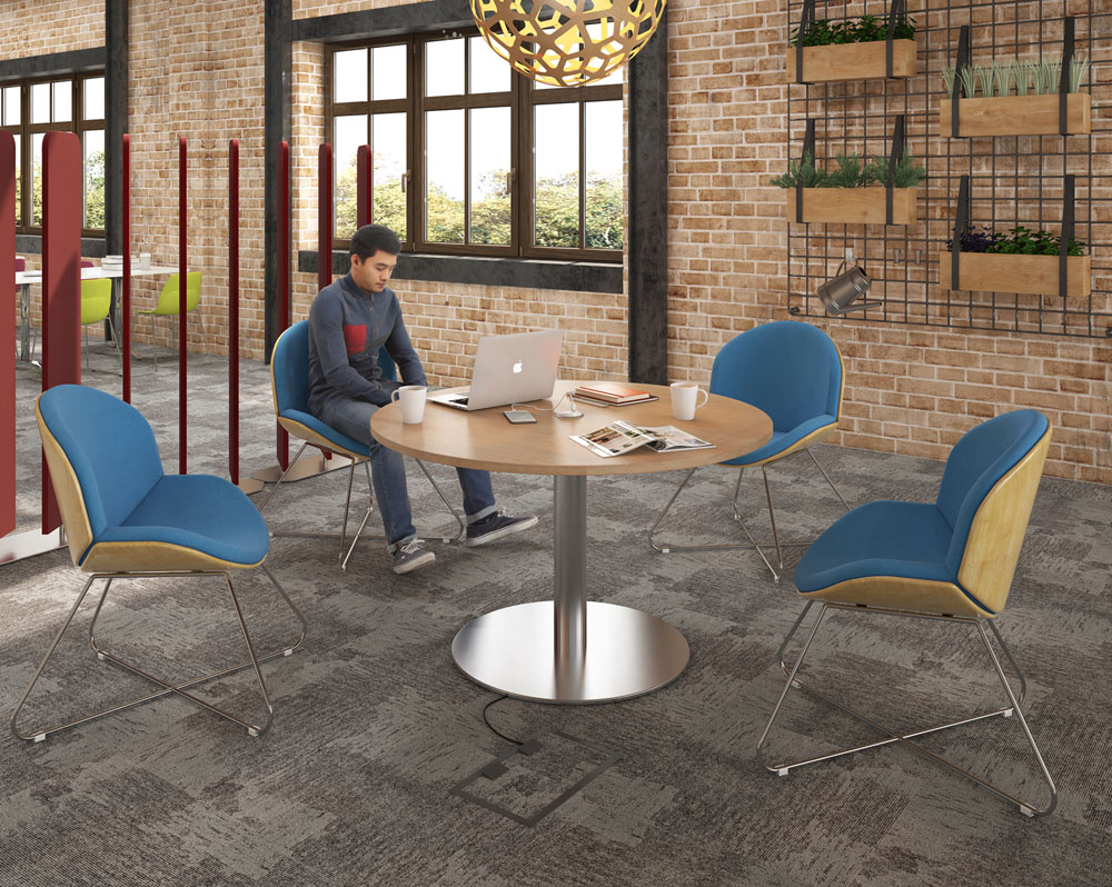 4 Multipurpose breakout chairs around a circular meeting table