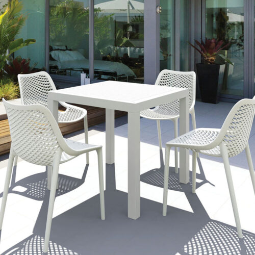 Four white outdoor breakout chairs around a square table