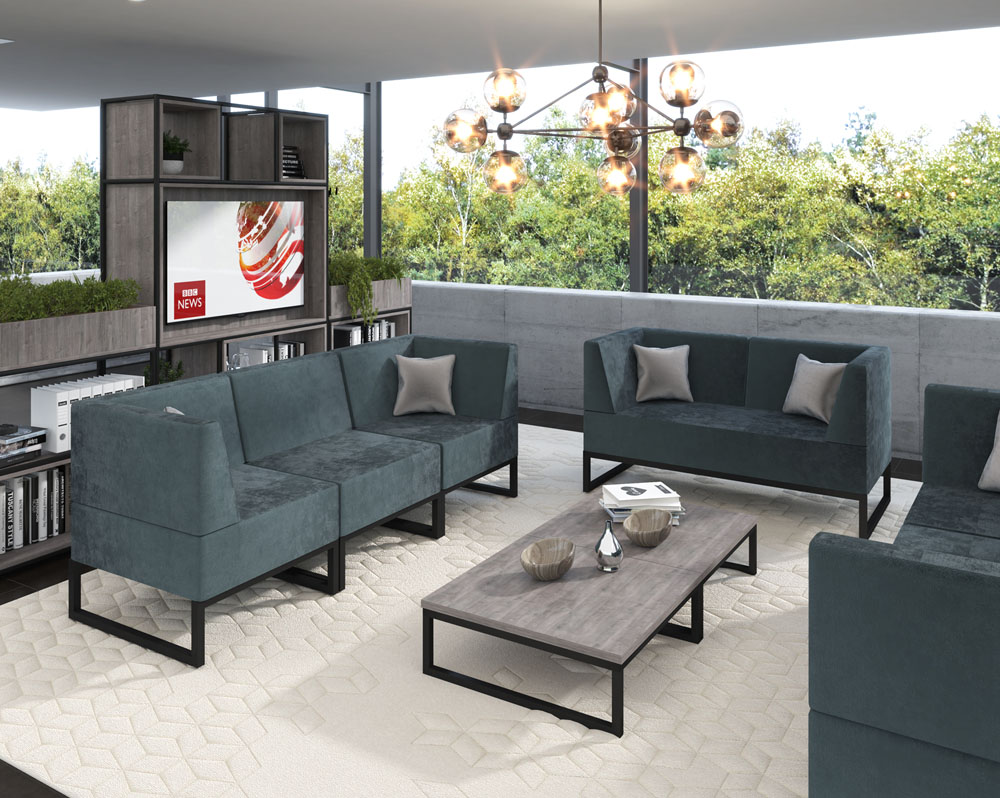 Sled framed reception sofa and chairs in green fabric and a rectangular coffee table