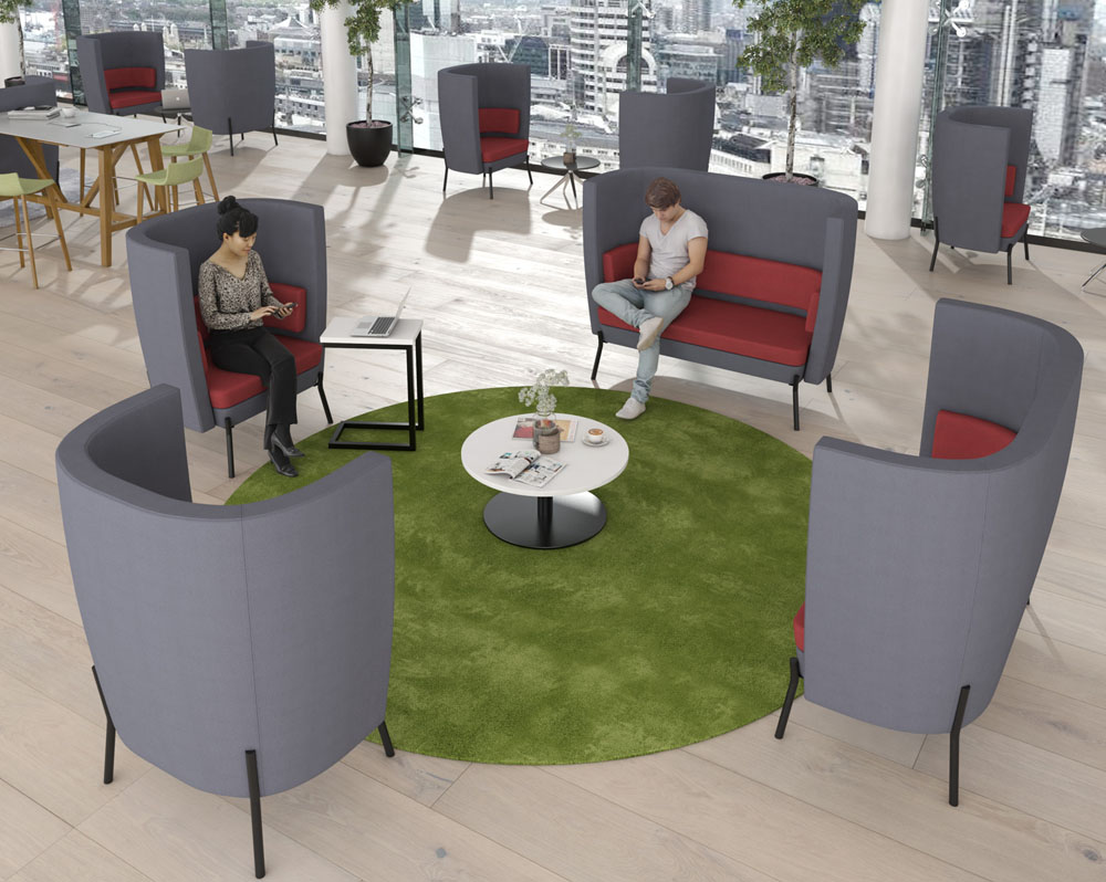 Social spaces high back sofa and armchairs in grey and maroon fabric, around a small white circular coffee table
