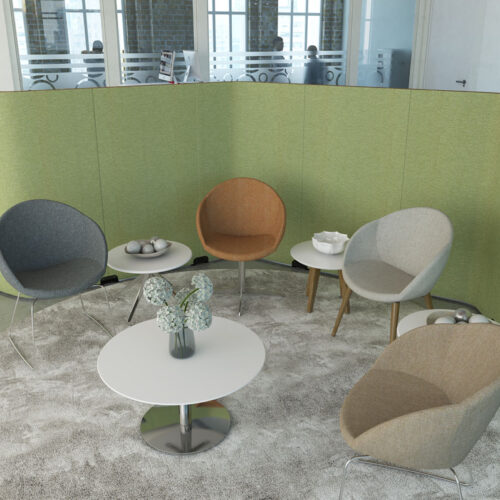 a selection of soft seating breakout chairs and a round coffee table.