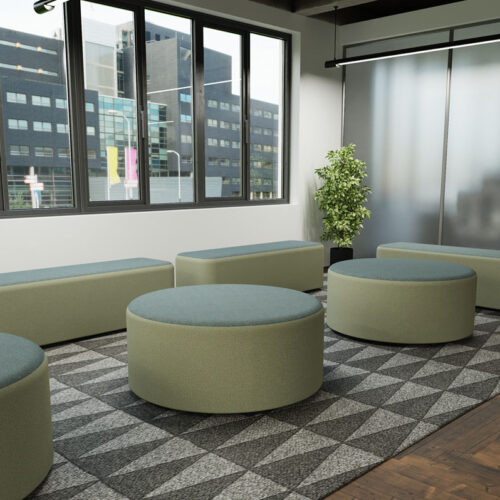 Reception soft seating in two tone green fabric, in a modern reception area