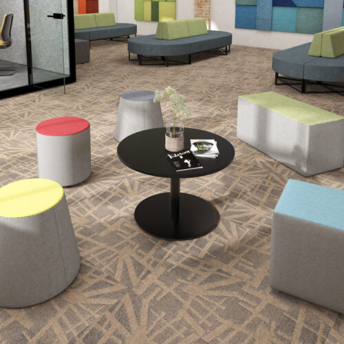 Upholstered stools in a soft seating area