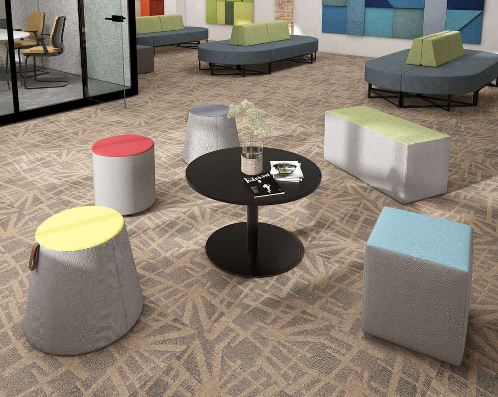 Upholstered stools in a soft seating area