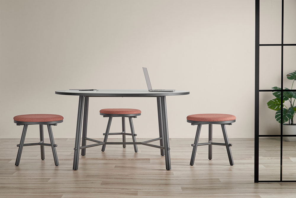 Aria table and 3 Aria stools, in a modern office.