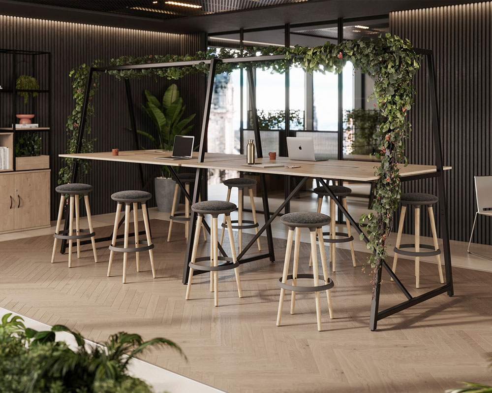 A beautiful Canopy table with artificial foliage and poseur height stools