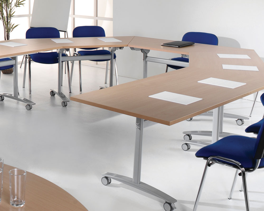 A group of flip top tables in a training room