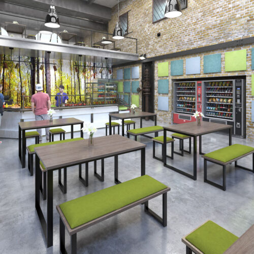 Metal framed tables and bench seating in a modern breakout area