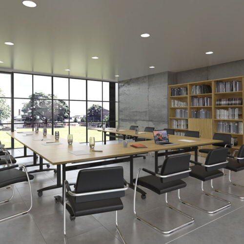 a group of modular tables in training room