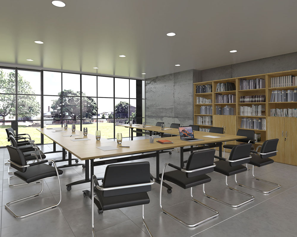 a group of modular tables in training room