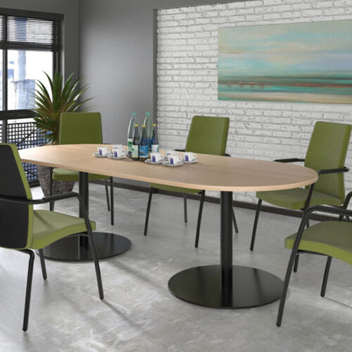 Radial end meeting table surrounded by green meeting chairs
