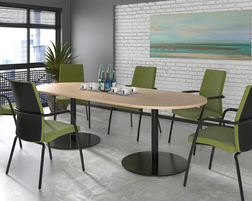 Radial end meeting table surrounded by green meeting chairs