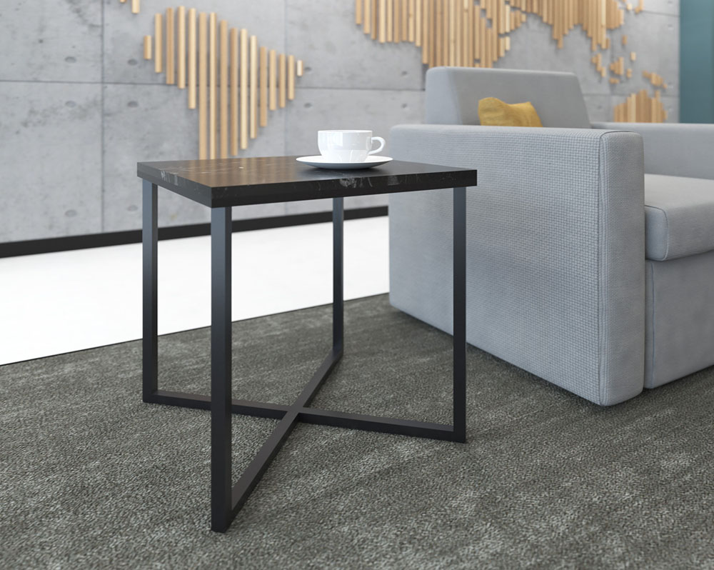 Side table with black frame, next to grey a sofa