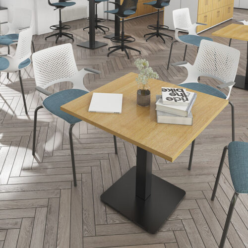 A square table in a modern canteen, surrounded by 3 canteen chairs