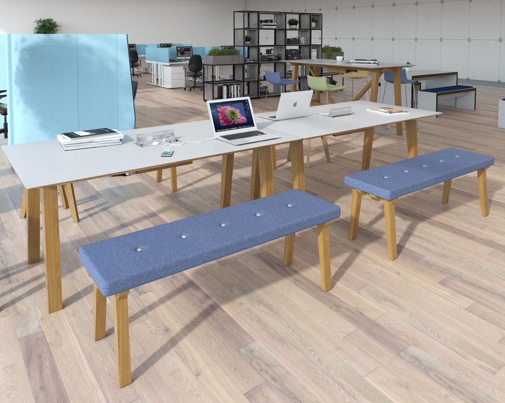 A large worktable surround by bench seats